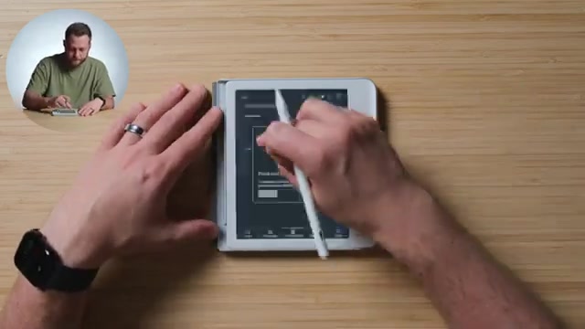 Kobo e-reader met een geopend menu op een houten tafel