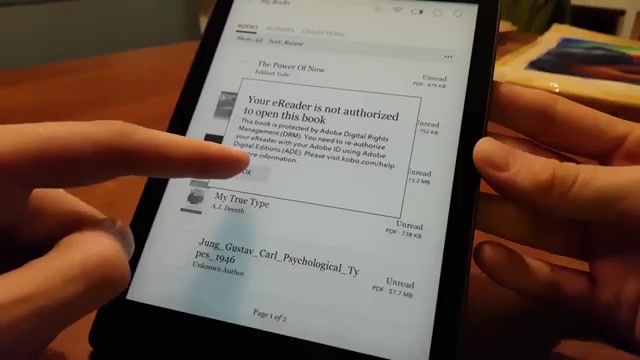Kobo e-reader met de melding dat hij niet bevoegd is om een boek met Adobe DRM te openen
